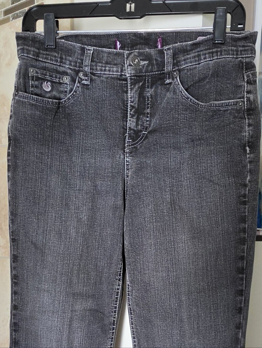 Vintage-wash straight-leg jeans with raw hems. Size 8-Short